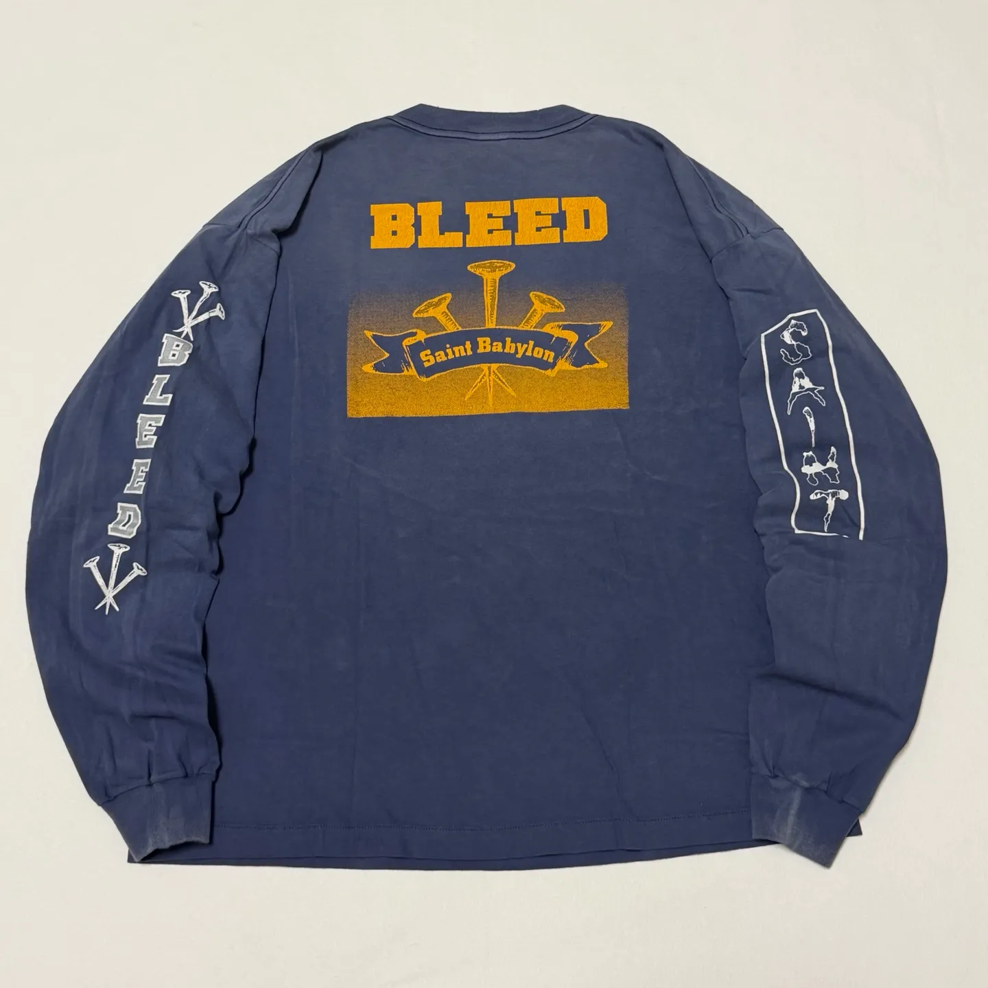 SAINT Mxxxxxx × BABYLON BBLN_LS TEE/SAINT BABYLON/NVY/BABYLON co-branded style Wolf head SAINT/nail distressed long sleeves Washed blue S-XL Completely matched Tube weaving fabric without side seams Garment dyeing Maliu water faded distressing Simulated sun fading treatment Natural fading Handmade holes and frayed Ink splashing treatment Correct main mark/wash mark/little angel anti-counterfeiting mark